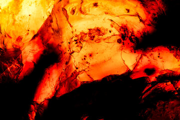 amber texture backlit. macro detail texture background. close-up raw rough unpolished semi-precious gemstone