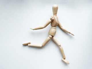 Wooden puppet running