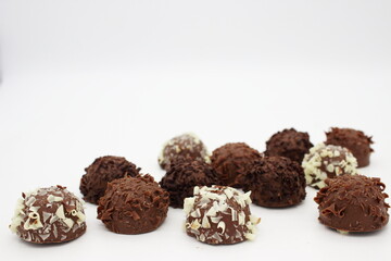 Several chocolates on white background