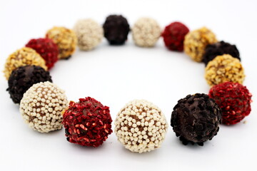 Several chocolates on white background