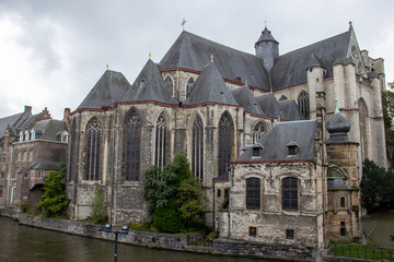 Fototapeta na wymiar Saint Michael's Church in Ghent, a masterpiece of Gothic architecture, stands tall with its stunning spire