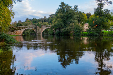 Fototapeta na wymiar Medieval stone bridge over the Arnoia river in the town of Allariz. Province of Ourense. Galicia, Spain