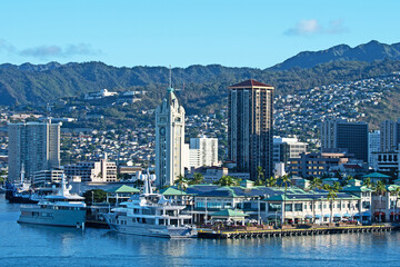 The Port of Honolulu in Hawaii with the Aloha Tower, a retired lighthouse that is considered one of...