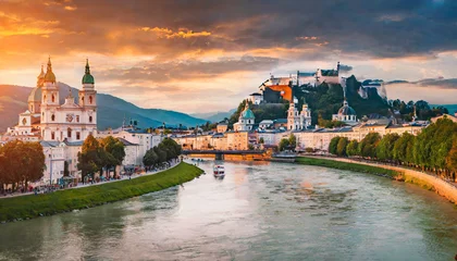 Keuken spatwand met foto panoramic summer cityscape of salzburg old city birthplace of famed composer mozart great sunset in eastern alps austria europe adorable evening landscape with salzach river © Mary