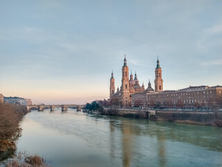 Fototapeta premium The Basilica of Our Lady of the Pillar seen from the Ebro river, Zaragoza, Spain