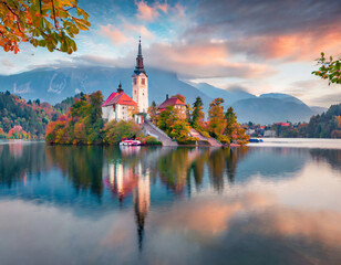 Attractive morning view of Pilgrimage Church of Assumption of Maria. Impressive autumn scene of Bled lake, Julian Alps, Slovenia, Europe. Traveling concept background - obrazy, fototapety, plakaty