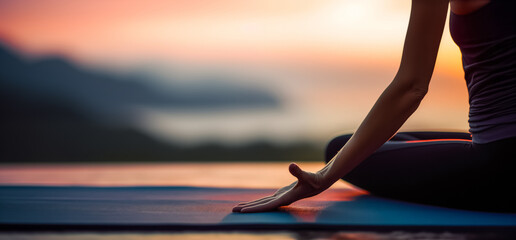 Woman Yoga at sunset. Young woman is practicing yoga at mountain lake. Relax in nature - obrazy, fototapety, plakaty