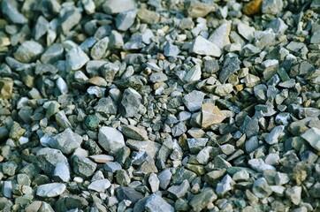 Background of stones and pebbles and small rough gray sharp stones
