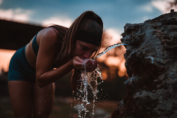 Gorgeous Woman Hydrating After Intense Workout in Nature