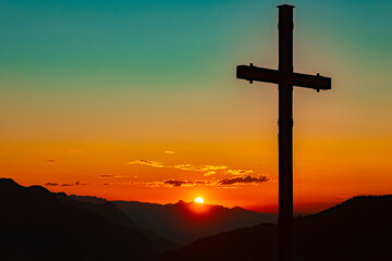 Alpine sunset with a summit cross at Mount Hochjoch, Schruns, Bludenz, Montafon, Sylvretta, Austria