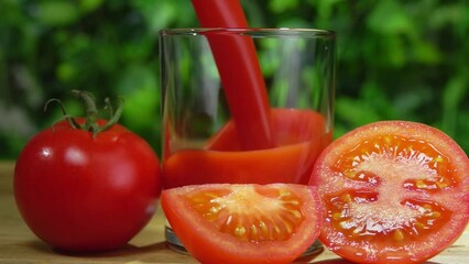 Delicious tomato juice is poured in jug