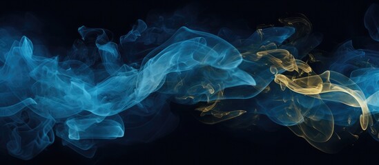 Blue and gold ink create an abstract smoke effect on a black background