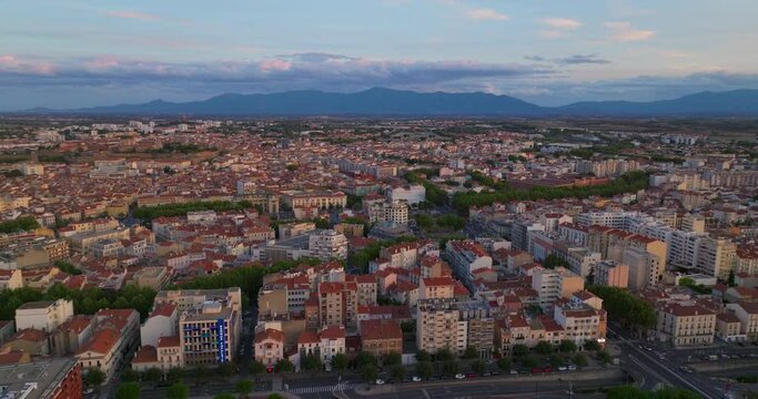 Establishing shot of french city of Perpignan is located on the seashore. Aerial view of the central area of a tourist city in summer. Drone view of the southern city of France. Center of city