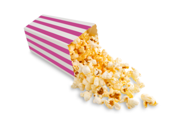 Tasty cheese popcorn falling out of pink striped carton bucket, isolated on white, transparent background, PNG. Scattering of popcorn grains. Movies, cinema and entertainment concept.