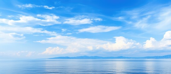 Fototapeta premium Clouds and sea under a blue sky