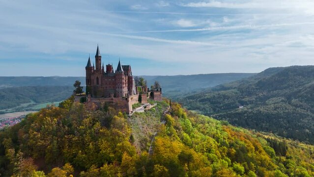 Aerial drone view of medieval Hohenzollern castle on top of hill in autumn, Baden-Wurttemberg, Germany. High quality 4k footage