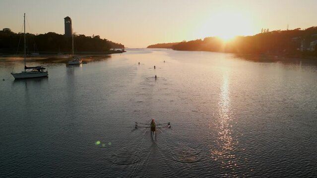 Rowboat Rowers Practice During a Beautiful Sunrise in Halifax Harbor, Canada.