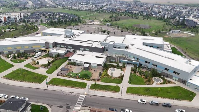 Aerial footage of Hampton Village, Saskatoon, SK, highlighting its contemporary homes, green spaces, and community amenities. A fresh suburban perspective, perfect for real estate and city planning.