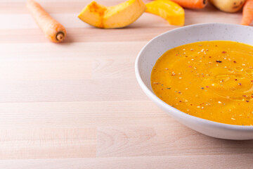 Pumpkin and carrot cream soup. Autumn dish suitable for lunch and dinner.