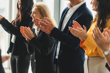 Group of business people clapping hands at successful presentation or conference. Cropped image focus on hand. Diverse male and female clapping hand to congratulate speaker. Side view. Intellectual. - obrazy, fototapety, plakaty