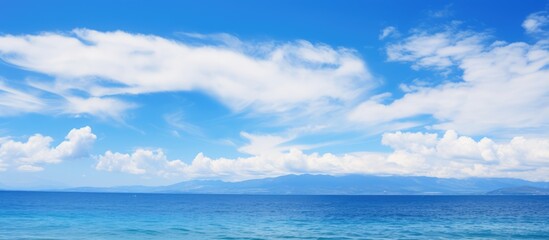 Naklejka na ściany i meble Gorgeous tropical sea with white cloud against blue sky for travel and vacation
