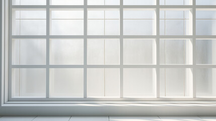 A white, rectangular window, with a textured pattern of lines and squares