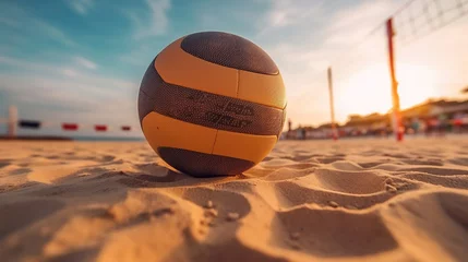 Fototapeten Focused ball on the beach sand, beach volleyball game under sunlight and blue sky blurred background © Gethuk_Studio