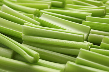 Fresh green cut celery as background, closeup