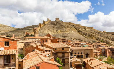 Fototapeta na wymiar View over rooftops and the historic wall on the hill in Albarracin, Spain