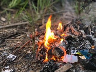 rubbish burn on the ground. waste burning