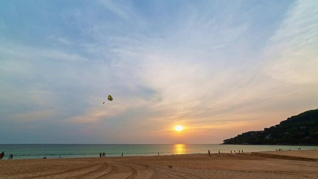 .time lapse colorful reflection of stunning sunset..beautiful scene with the sun painting the sky above waves .breaking gently on a sandy.Gradient sweet color. abstract nature background.