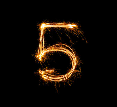 Fireworks numbers 5 Burning sparkler Numbers isolated on black background. Sparkler firework light alphabet 5 and number five. Numbers Alphabet of Sparklers