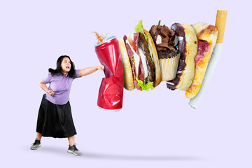 Picture of beautiful fat woman punching soft drink and fast food