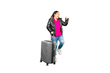 Full length body size of a happy asian woman walking with a suitcase isolated on white background