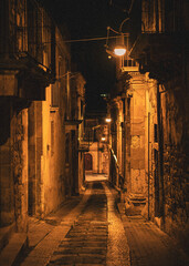 The narrow streets of the baroque style city of Modica, Sicily, Italy - 669769942