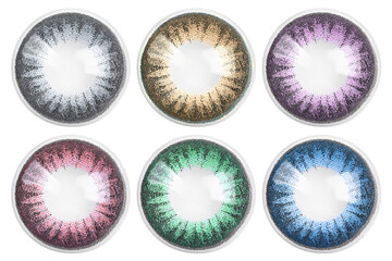 Many contact lenses in different colors isolated on white, collection