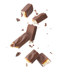 Pieces of chocolate bars falling on white background