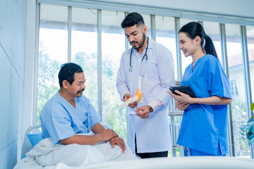 Healthcare and medical concept. Medicine muslim Doctor and nursing assistant with a stethoscope in hand and Patients come to the hospital background. The doctor suggested an ankle bone injury.