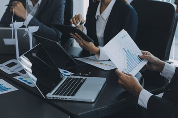 Close up of Business team analyzing income charts and graphs with modern laptop computer. Business analysis and strategy concept.