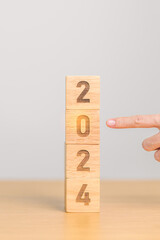 2024 year block on table. goal, Resolution, strategy, plan, start, budget, mission, action,...
