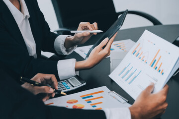 Close up of Business team analyzing income charts and graphs with modern laptop computer. Business analysis and strategy concept.