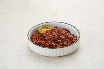 Sambel or Sambal Terasi is traditional food which is popular in Indonesia. Made from tomatoes, chilies, salt, sugar, garlic, shallots and shrimp paste (terasi).
