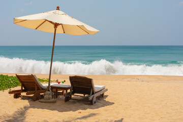 beach with umbrella and chairs