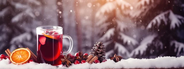 Zelfklevend Fotobehang A cup of hot warming tea in winter weather overlooking the snowy forest. hot winter medicinal drink. Black tea. © AndErsoN