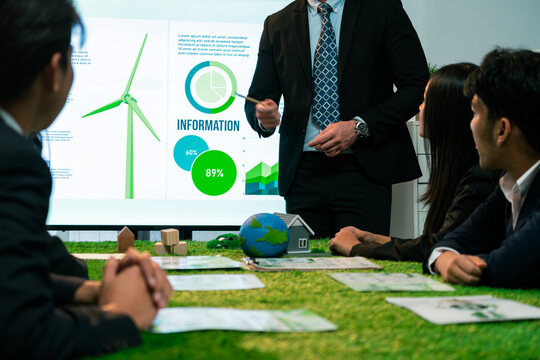 Businessman leader give presentation on eco-friendly implementation in order to reduce CO2 emission and make sustainable ecology for greener future with renewable alternative energy technology. Quaint