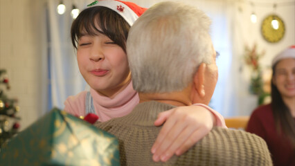 Obraz premium Happy asian family celebrating Christmas and New Year together at home.