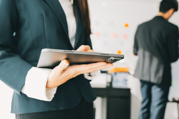 Fototapeta premium Business team working with new startup project plan and discussion information for financial strategy with laptop and digital tablet in a modern business lounge.