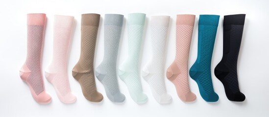 Compression hosiery for varicose veins and venous therapy including medical stockings socks and sleeves as well as clinical knits and sports socks on white background