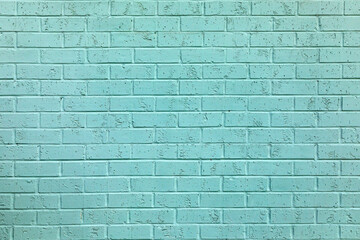 old brick wall painted in light blue