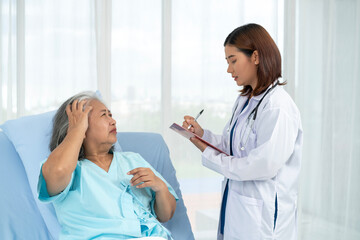A neurologist observes an elderly female patient's headache and notes the symptoms.